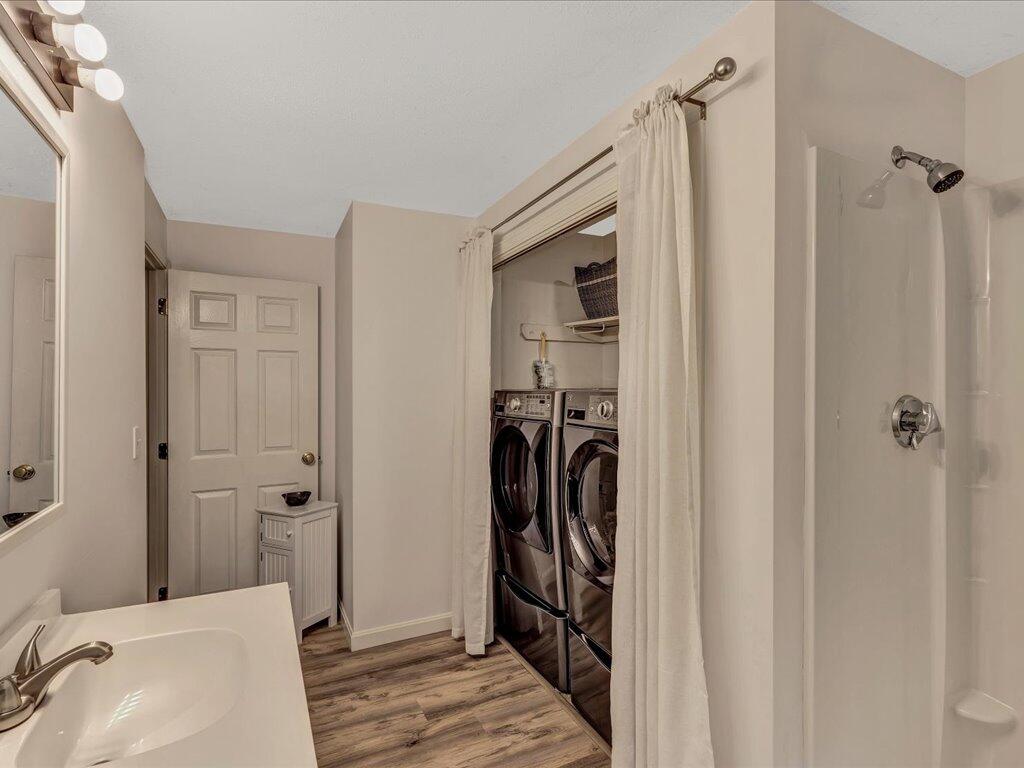 25 Moon Compass Lane Sandwich, MA 02563 - Photo 27 of 55 a bathroom with a sink and a mirror