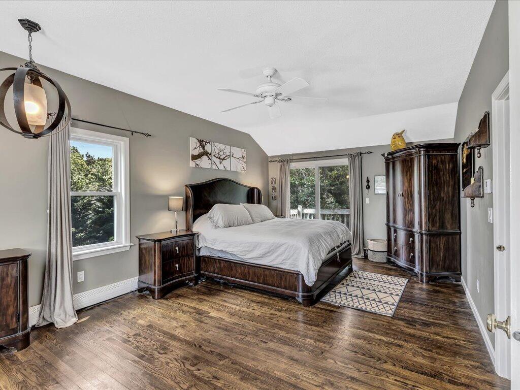 25 Moon Compass Lane Sandwich, MA 02563 - Photo 36 of 55 a large bedroom with a bed and a window