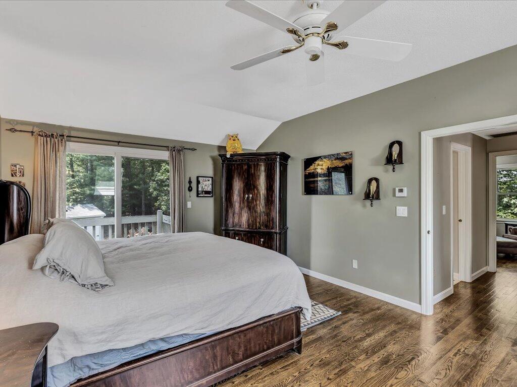 25 Moon Compass Lane Sandwich, MA 02563 - Photo 38 of 55 a bedroom with a large bed and a window