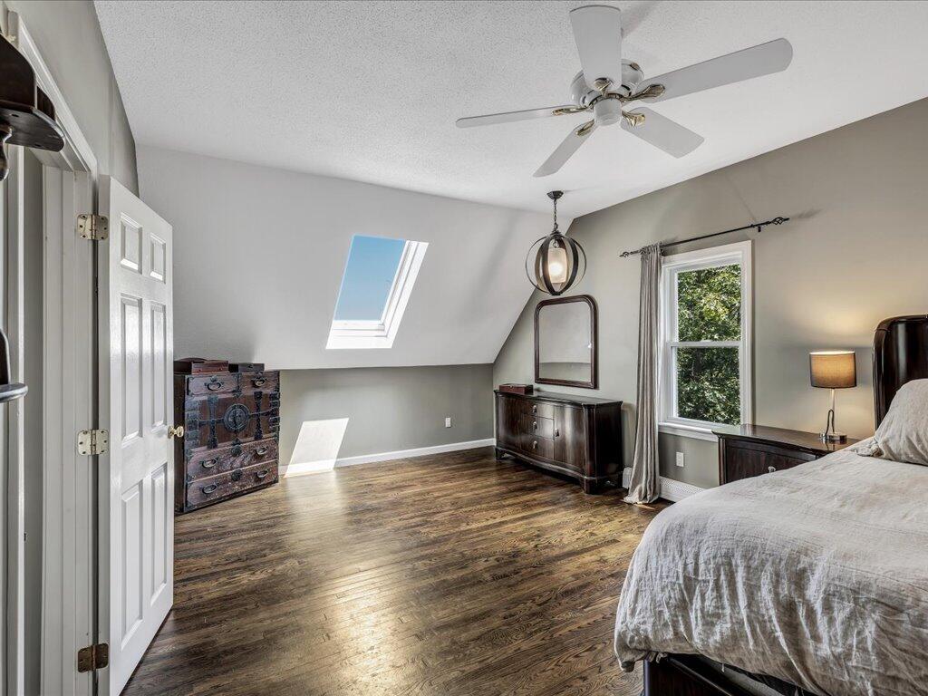 25 Moon Compass Lane Sandwich, MA 02563 - Photo 40 of 55 a bedroom with a bed and a chandelier