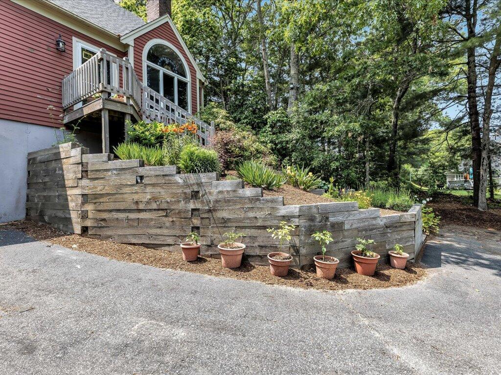 25 Moon Compass Lane Sandwich, MA 02563 - Photo 5 of 55 front view of a house with a tree
