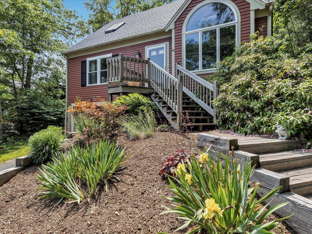 25 Moon Compass Lane Sandwich, MA 02563 - Photo 6 of 55 a front view of a house with a yard