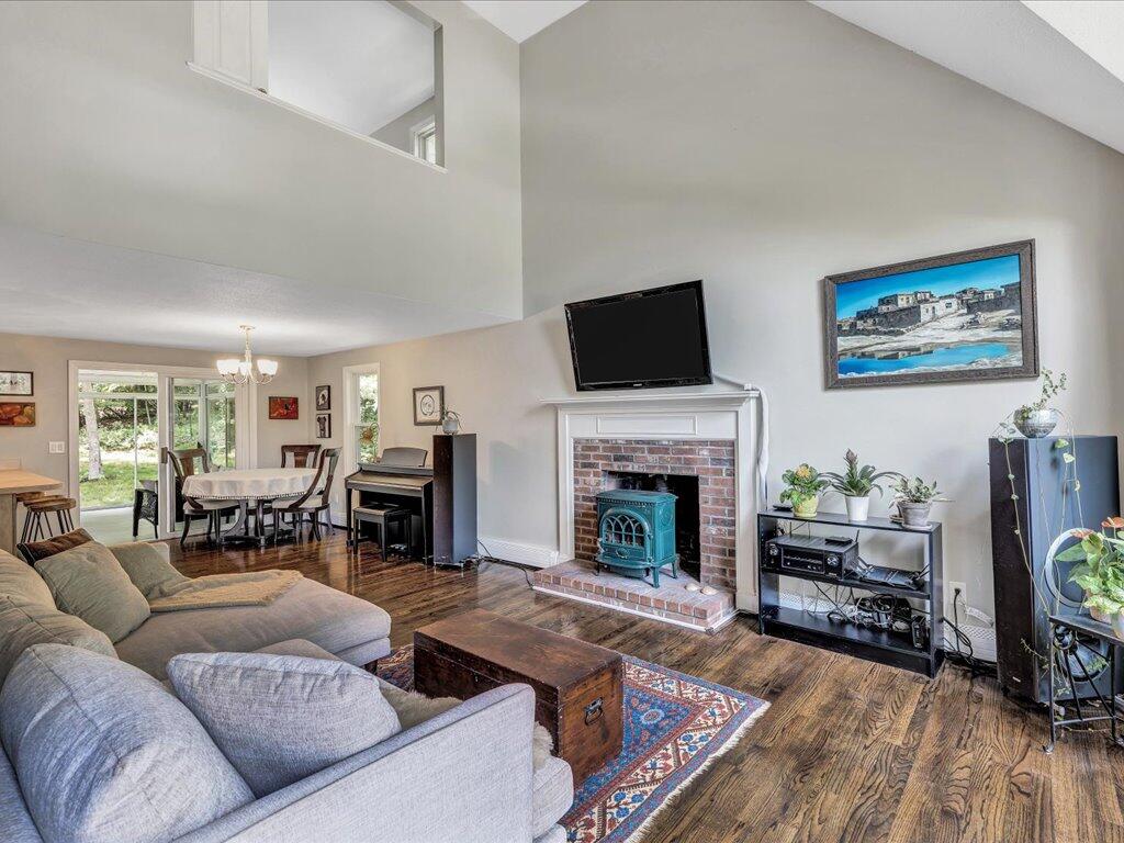 25 Moon Compass Lane Sandwich, MA 02563 - Photo 7 of 55 a living room with furniture a flat screen tv and a fireplace