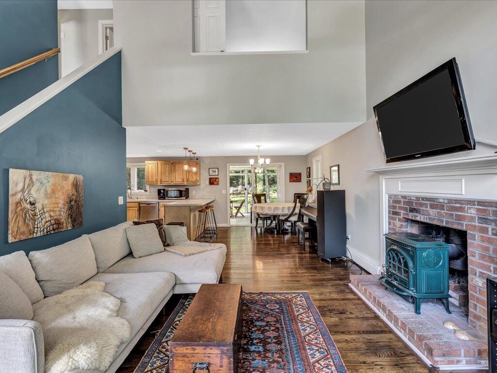 25 Moon Compass Lane Sandwich, MA 02563 - Photo 8 of 55 a living room with furniture and a fireplace