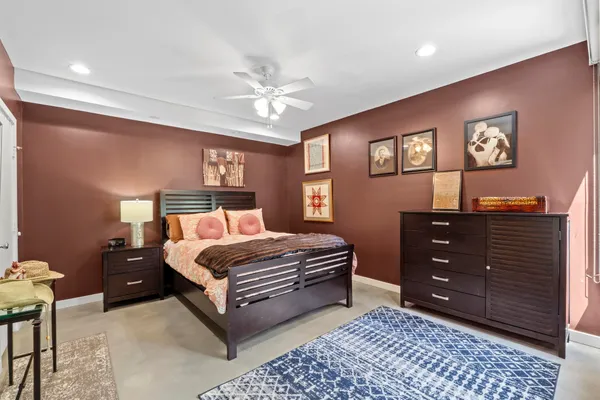 a bedroom with a bed and a dresser