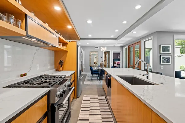 a kitchen with a stove and a sink