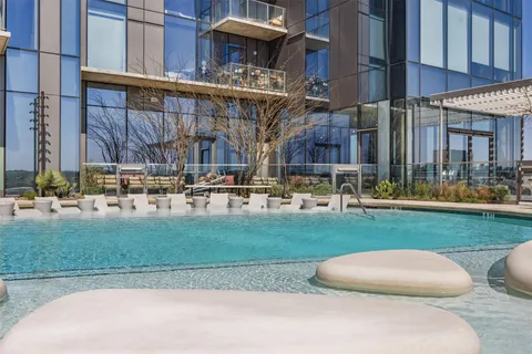 a building view with couches and a table in front of a building
