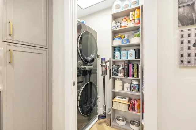 a view of a bedroom with washer and dryer