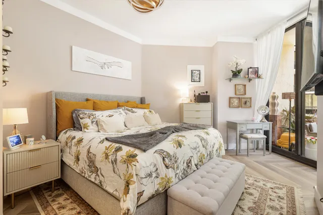 a bedroom with a bed and a couch