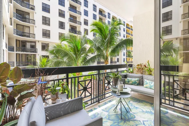 a view of a balcony with chairs