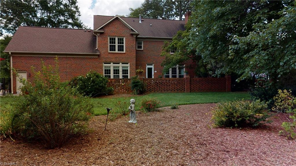4000 Rockingham Road South Greensboro, NC 27407 - Photo 4 of 26 Backyard and Patio with brick wall