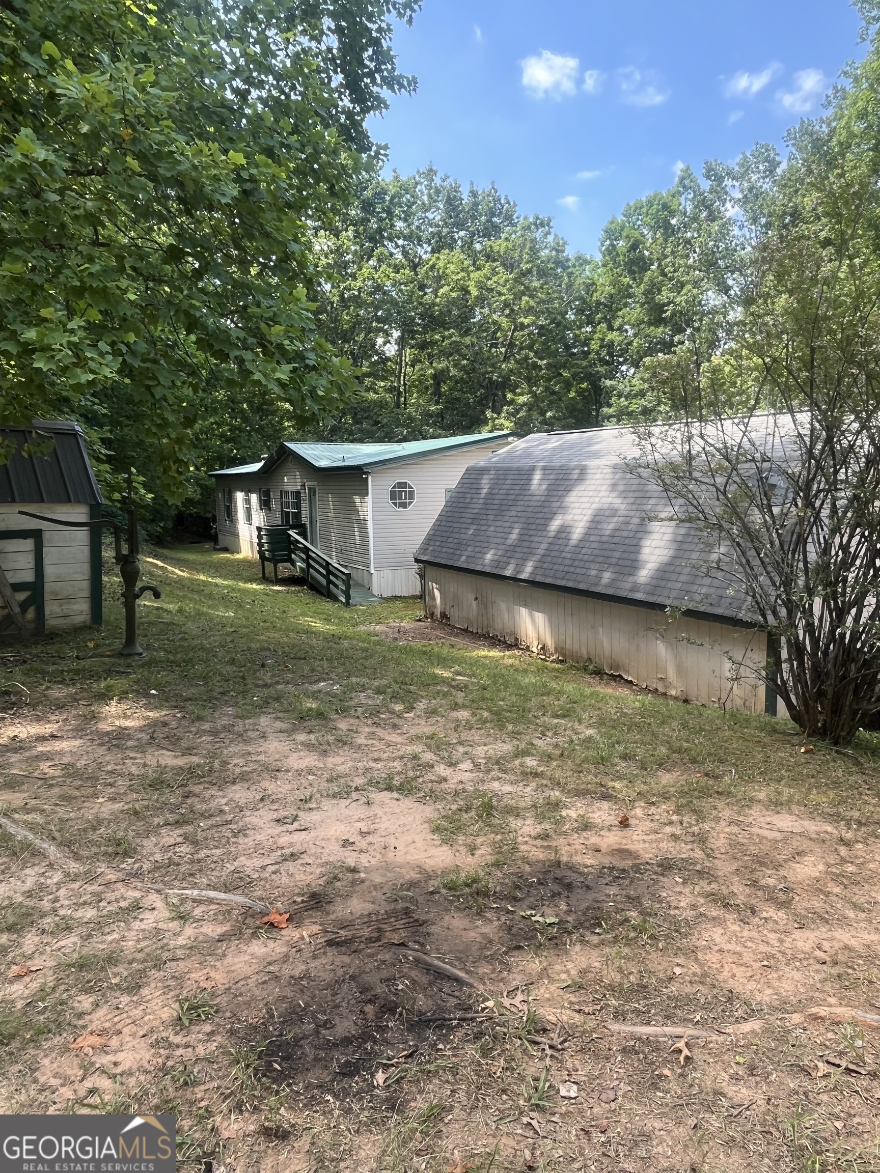 3246 Paradise Valley Road Cleveland, GA 30528 - Photo 1 of 1 a view of a house with backyard