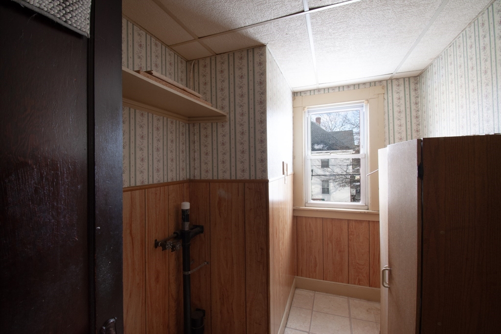39-41 Malden Street Springfield, MA 01108 - Photo 13 of 27 a bathroom with a shower and a window
