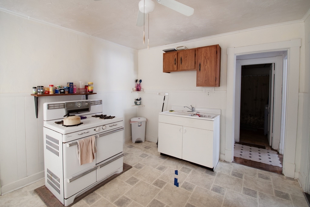 39-41 Malden Street Springfield, MA 01108 - Photo 2 of 27 a kitchen with a stove and a sink