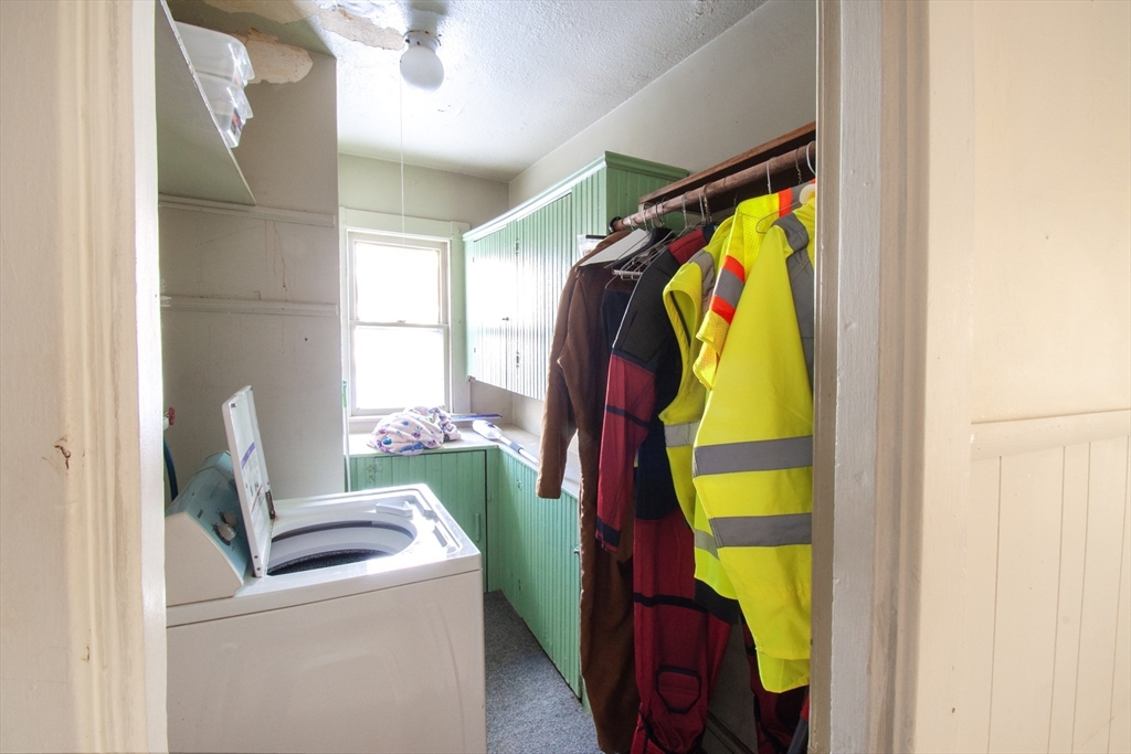 39-41 Malden Street Springfield, MA 01108 - Photo 4 of 27 a view of walk in closet with clothes and shoes