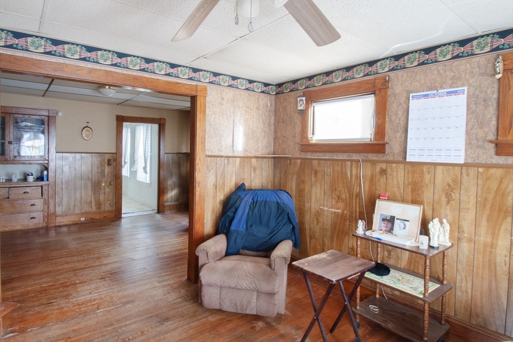 39-41 Malden Street Springfield, MA 01108 - Photo 6 of 27 a living room with furniture and a window