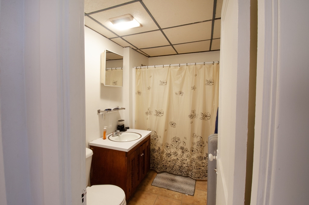 39-41 Malden Street Springfield, MA 01108 - Photo 7 of 27 a bathroom with a sink and mirror