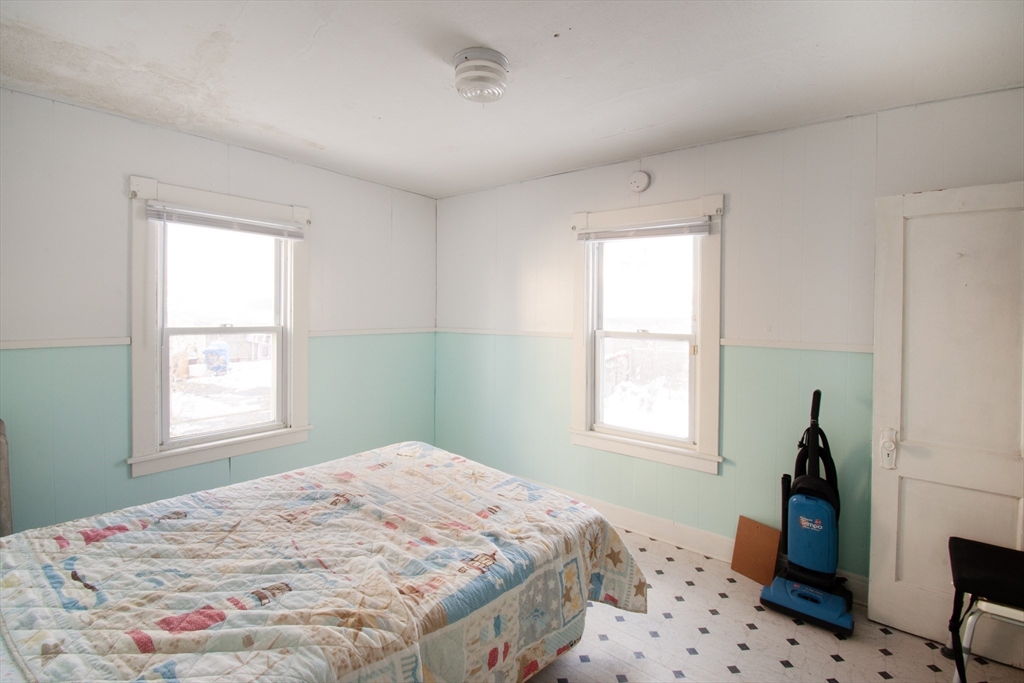 39-41 Malden Street Springfield, MA 01108 - Photo 10 of 27 a bedroom with a bed and a window