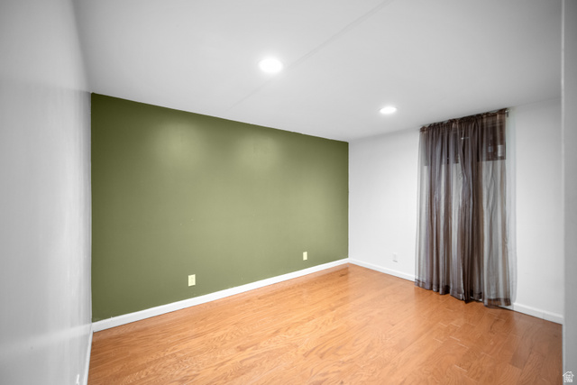 3233 Jean Street Magna, UT 84044 - Photo 25 of 33 Room with wood-finish flooring, recessed lighting, and a window with sheer drapes