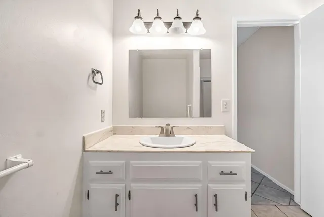 a view of backyard path and trees