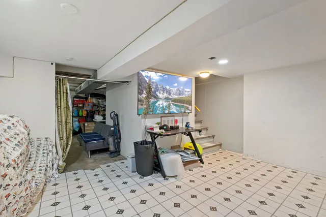 a bedroom with furniture and a bed