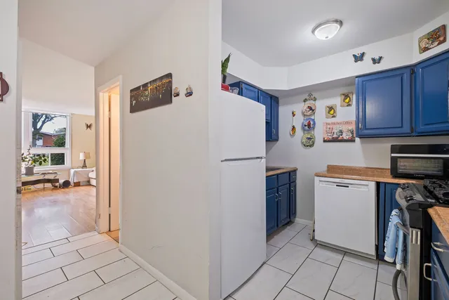 a white refrigerator freezer sitting in a kitchen