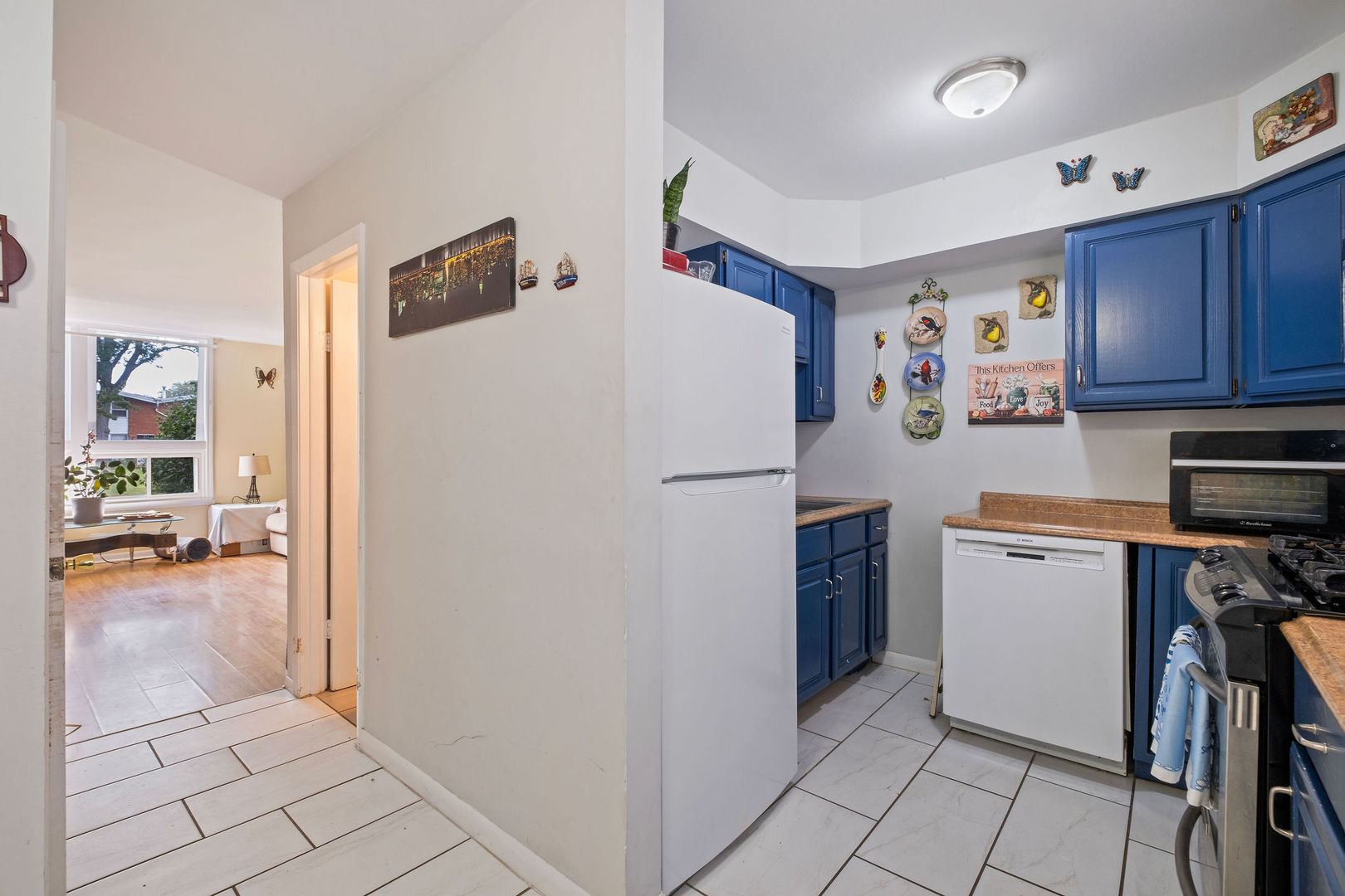 1578 Woodland Avenue, Unit D Des Plaines, IL 60016 - Photo 6 of 17 a white refrigerator freezer sitting in a kitchen