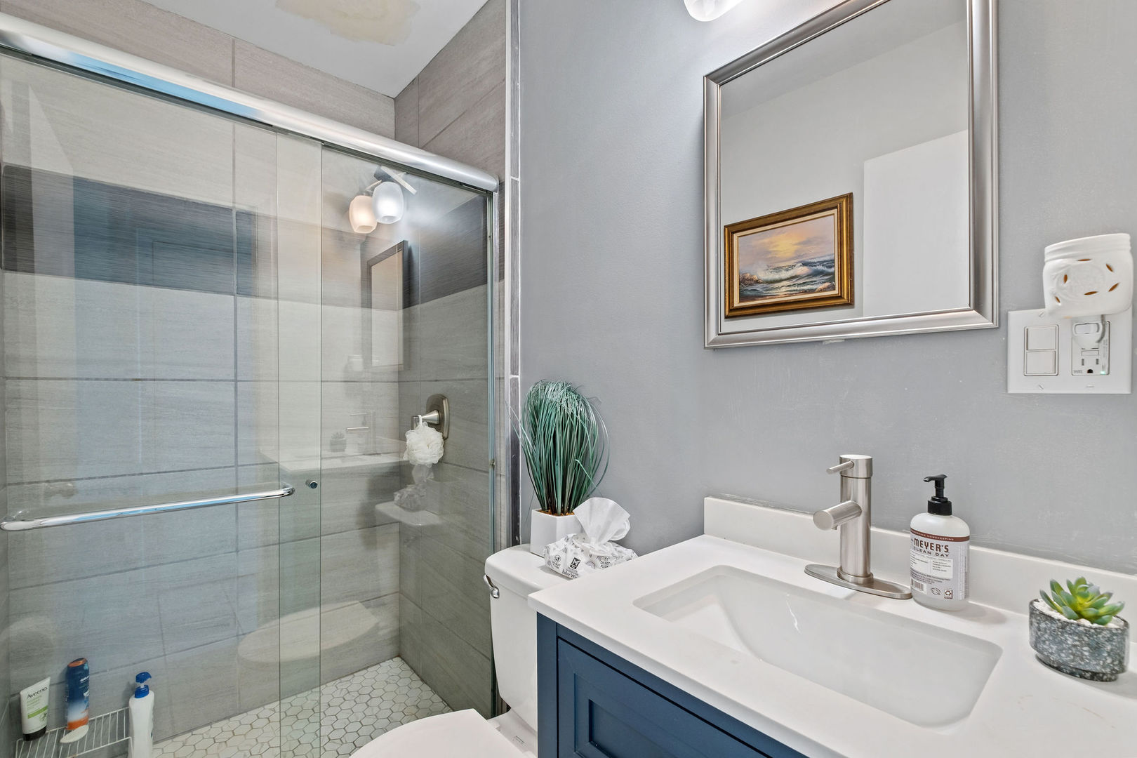1578 Woodland Avenue, Unit D Des Plaines, IL 60016 - Photo 7 of 17 a bathroom with a sink a toilet and shower