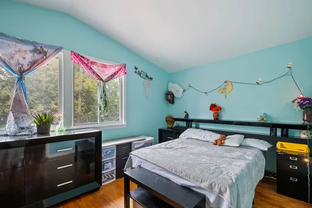 a view of a room with furniture and window