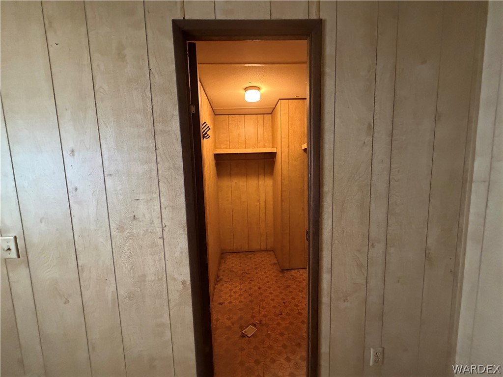 1666 Talc Road Bullhead City, AZ 86442 - Photo 24 of 61 Interior space featuring light-toned wood paneling, a flush-mount ceiling light, and a built-in shelf