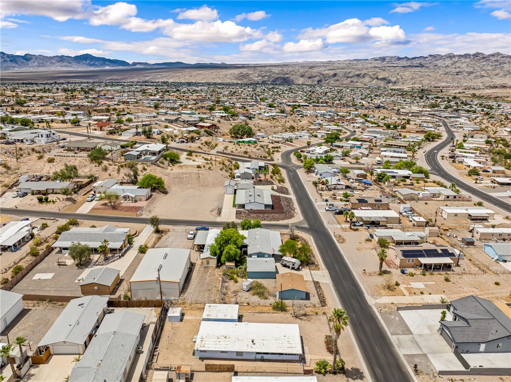 1666 Talc Road Bullhead City, AZ 86442 - Photo 52 of 61 Expansive desert community featuring residential structures with pitched and flat roofs