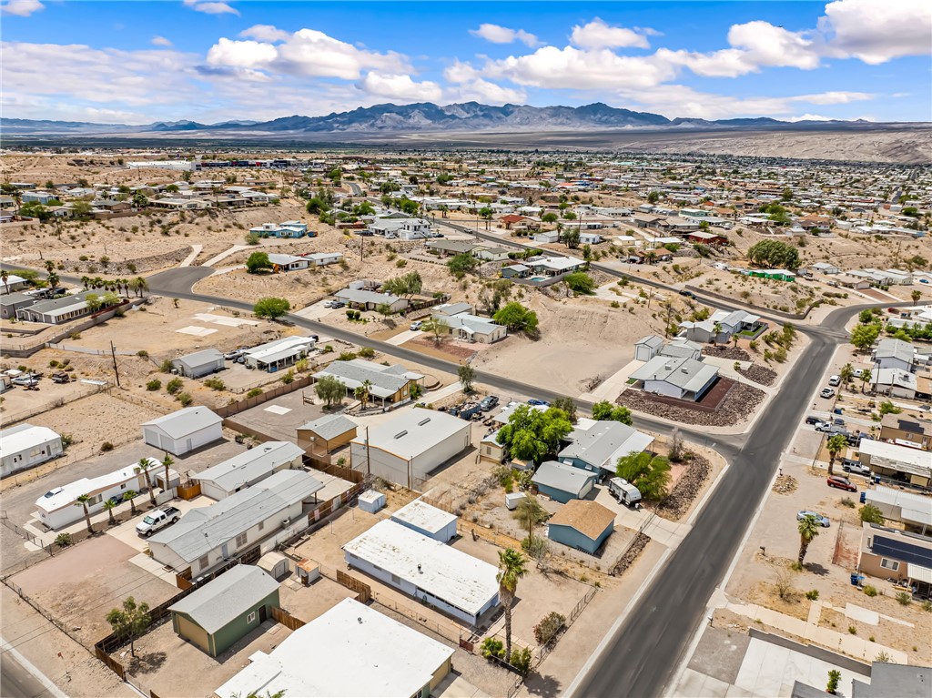 1666 Talc Road Bullhead City, AZ 86442 - Photo 53 of 61 Expansive aerial view showcasing a desert community with paved roads and a mountainous backdrop