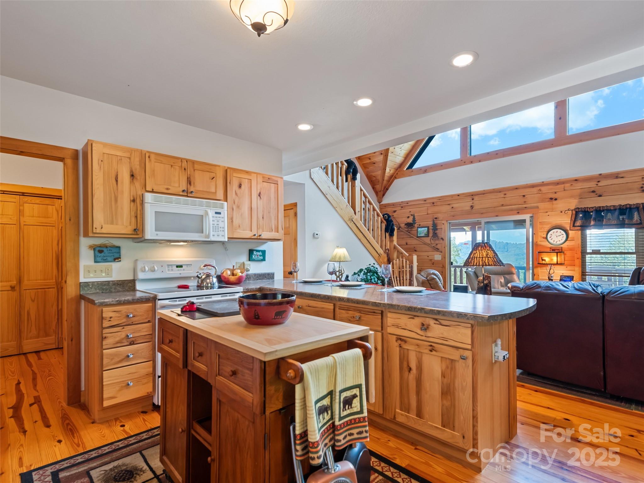 432 Raccoon Point Waynesville, NC 28786 - Photo 15 of 48 a kitchen that has a lot of cabinets in it