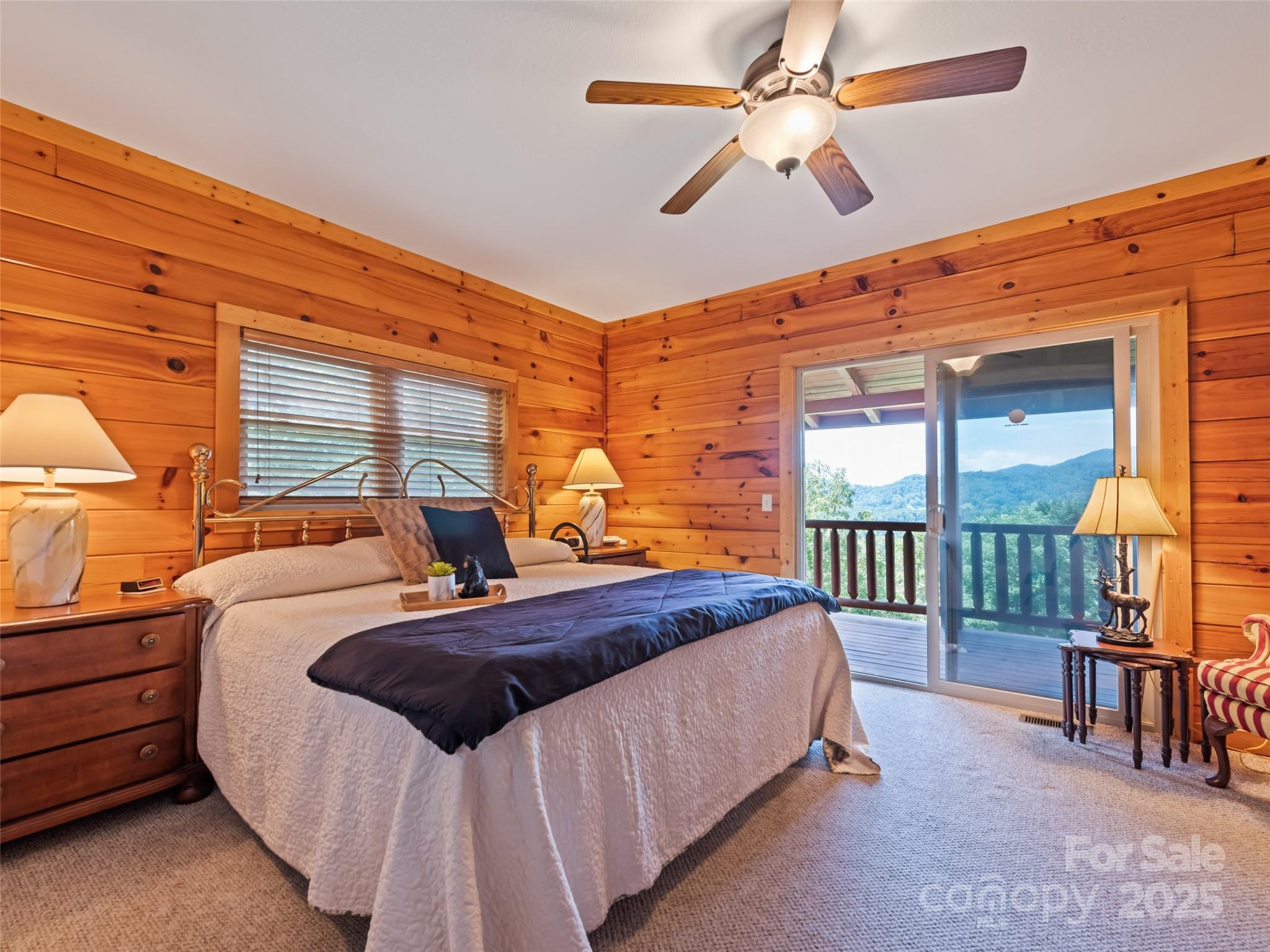 432 Raccoon Point Waynesville, NC 28786 - Photo 18 of 48 a bedroom with two beds and a chandelier