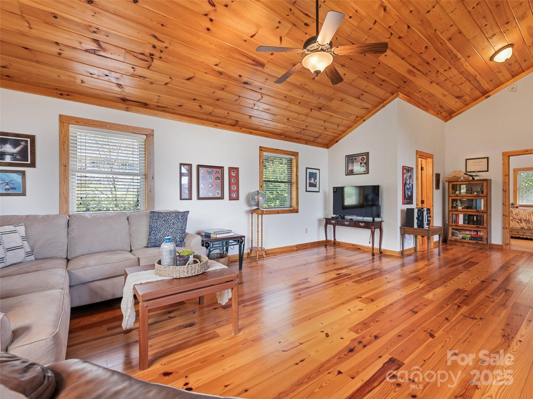 432 Raccoon Point Waynesville, NC 28786 - Photo 24 of 48 a living room with furniture and a wooden floor