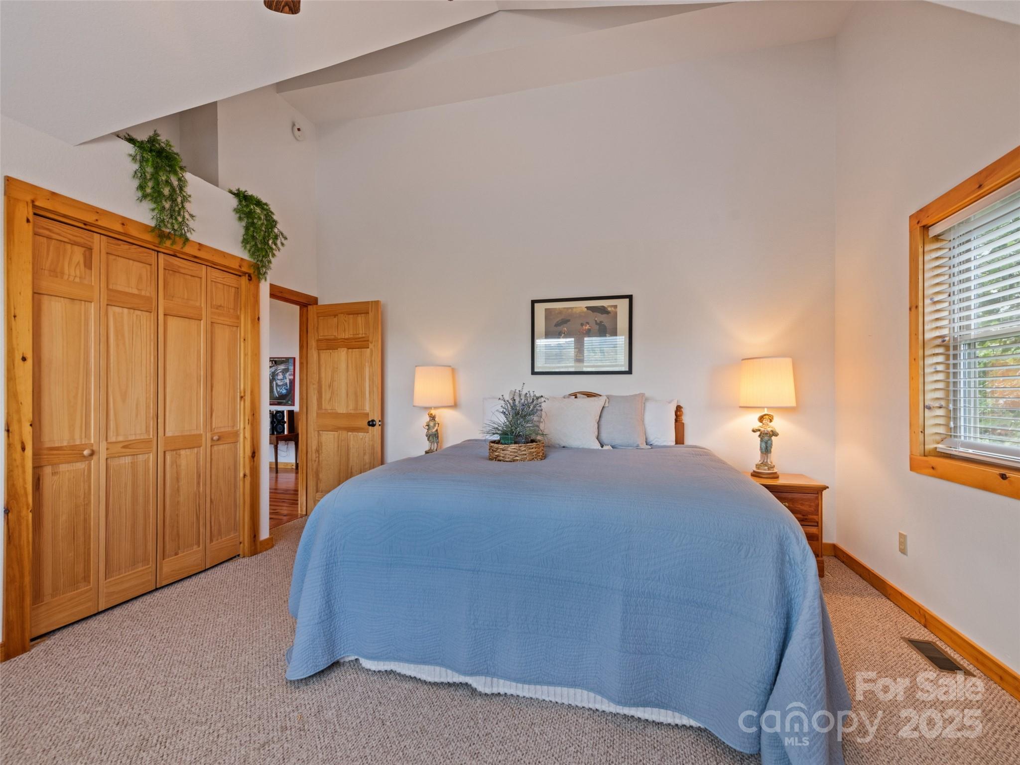 432 Raccoon Point Waynesville, NC 28786 - Photo 27 of 48 a bedroom with a bed and a window
