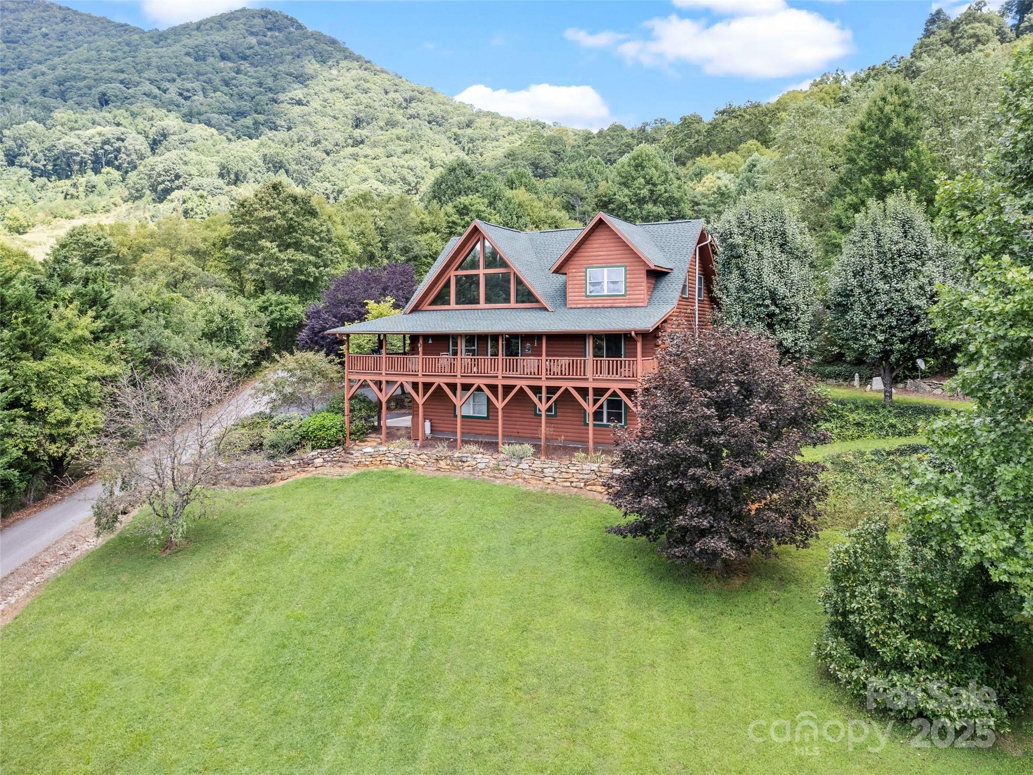 432 Raccoon Point Waynesville, NC 28786 - Photo 3 of 48 a view of a house with pool and sitting area