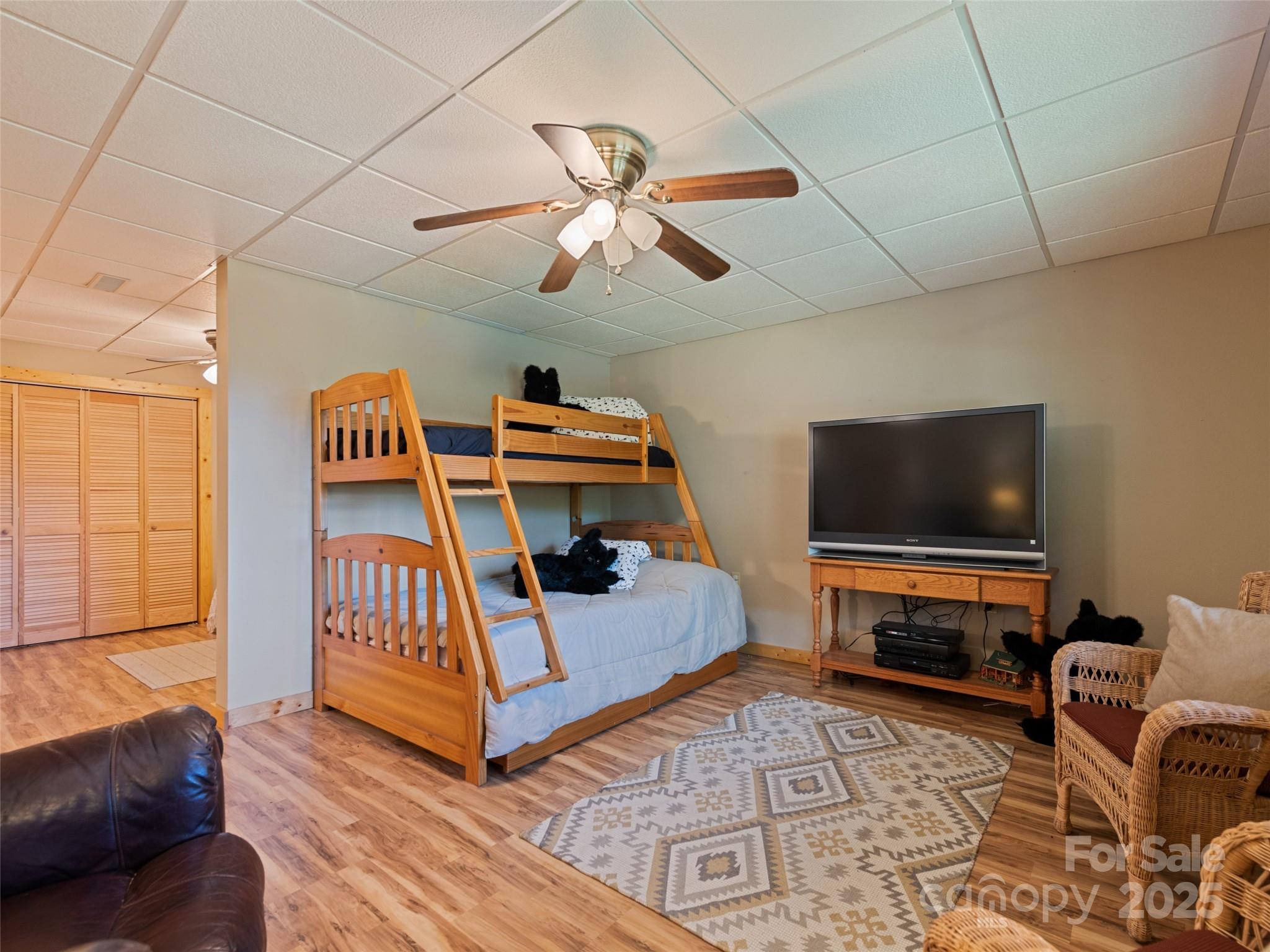 432 Raccoon Point Waynesville, NC 28786 - Photo 31 of 48 a living room with furniture and a flat screen tv