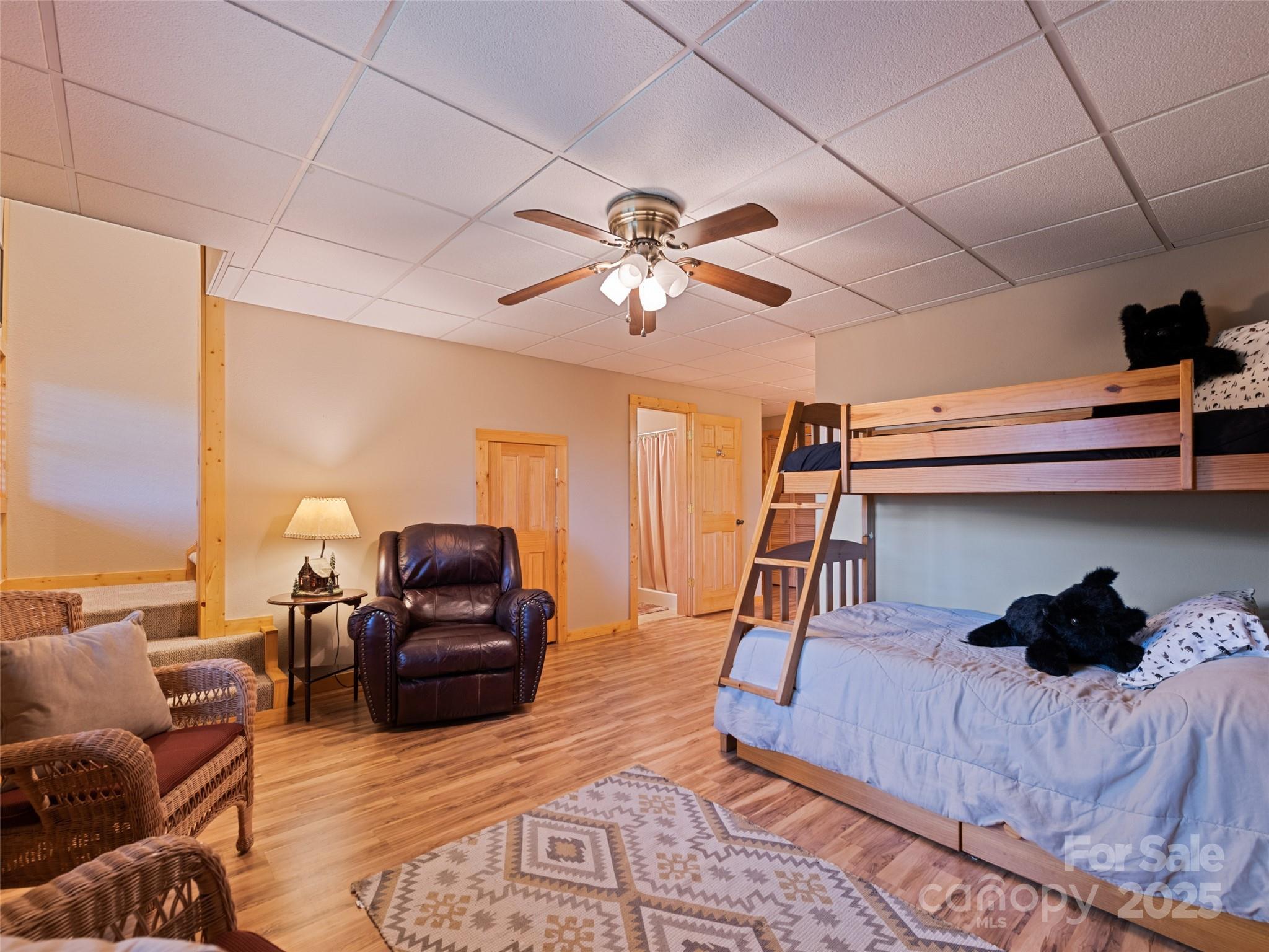 432 Raccoon Point Waynesville, NC 28786 - Photo 32 of 48 a living room with furniture and a lamp