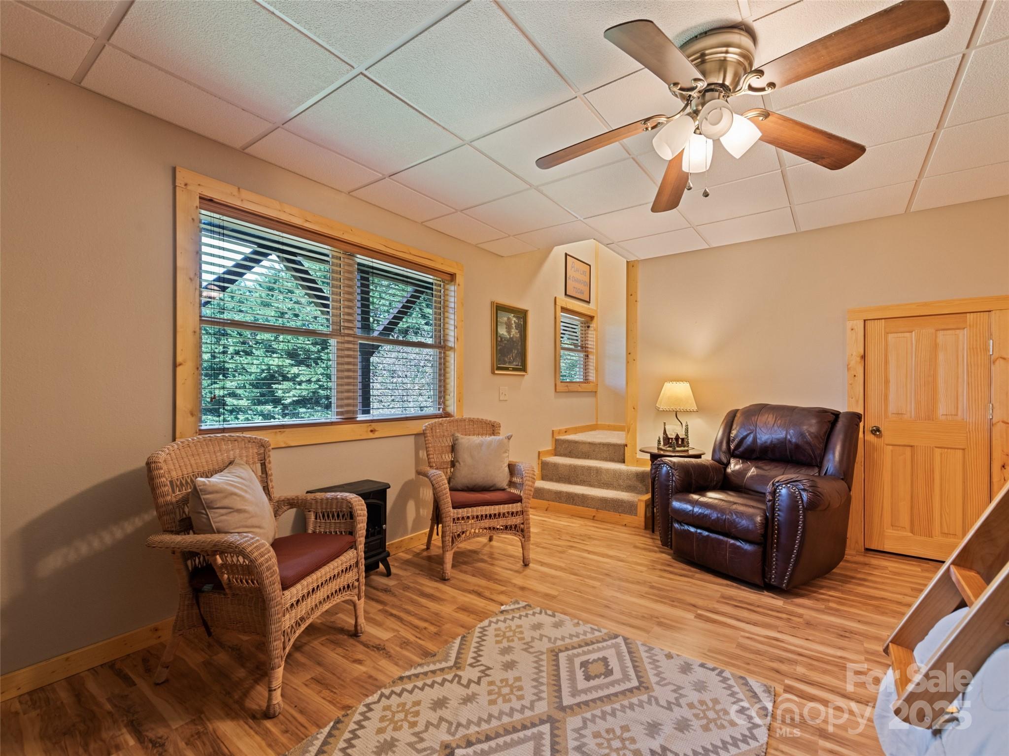 432 Raccoon Point Waynesville, NC 28786 - Photo 33 of 48 a living room with furniture ceiling fan and a window