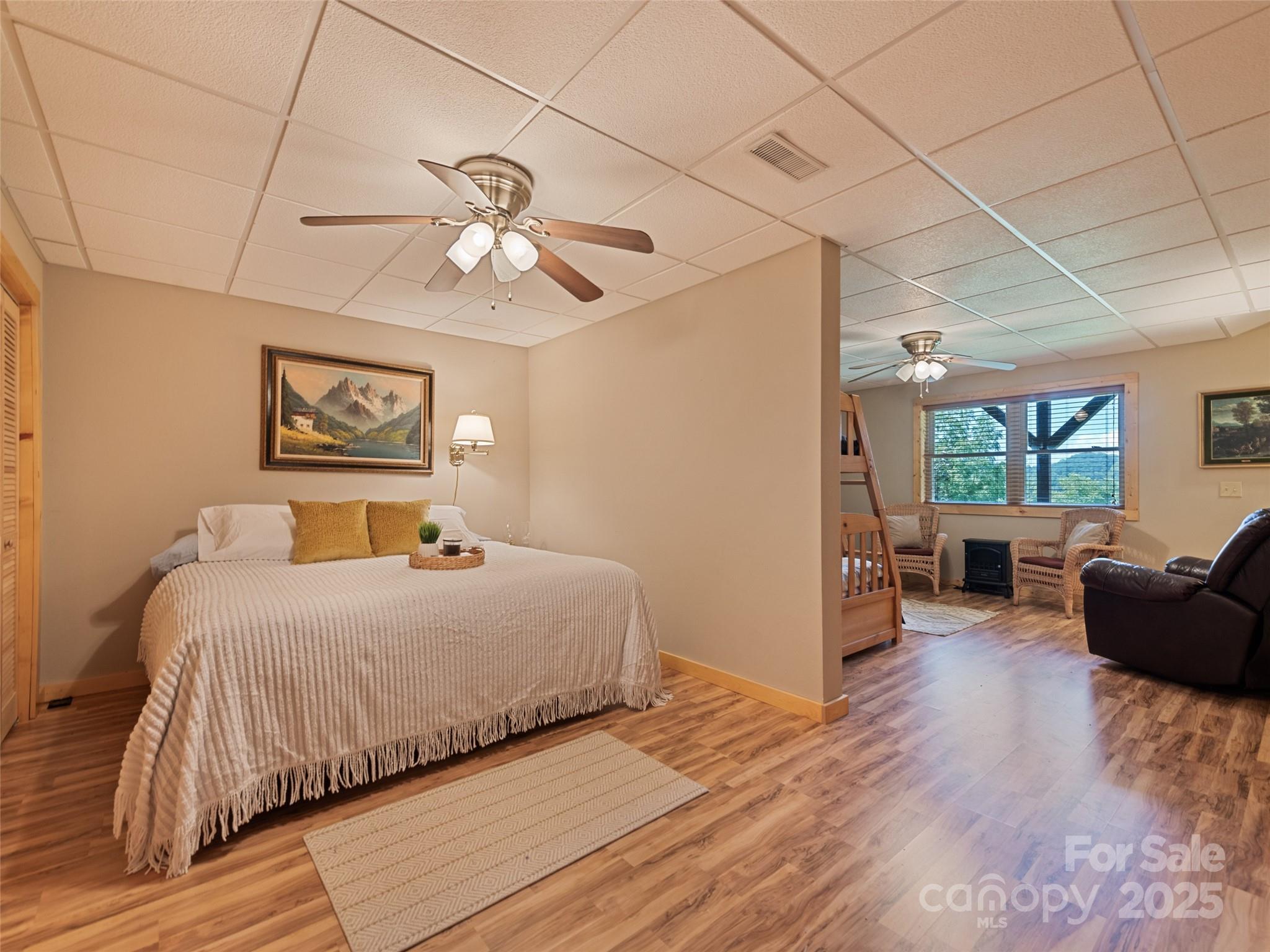 432 Raccoon Point Waynesville, NC 28786 - Photo 35 of 48 a bedroom with a bed couch and a window