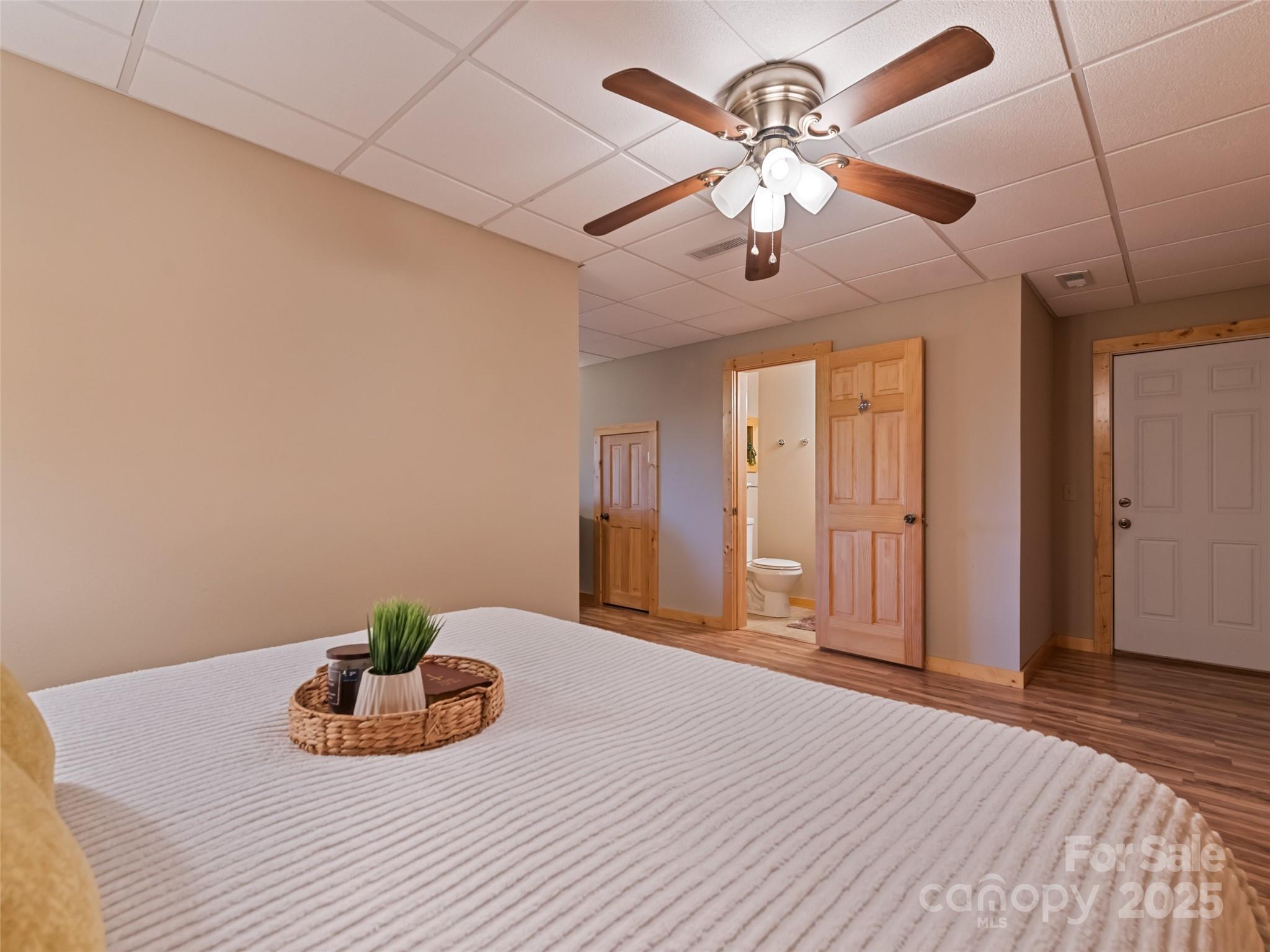 432 Raccoon Point Waynesville, NC 28786 - Photo 36 of 48 a view of a livingroom with a chandelier furniture and wooden floor
