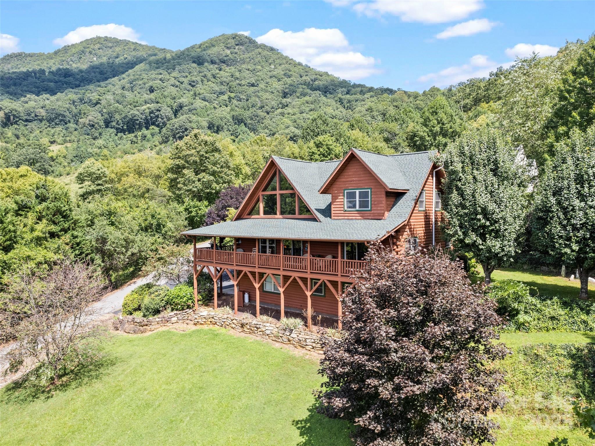 432 Raccoon Point Waynesville, NC 28786 - Photo 41 of 48 an aerial view of a house with a yard