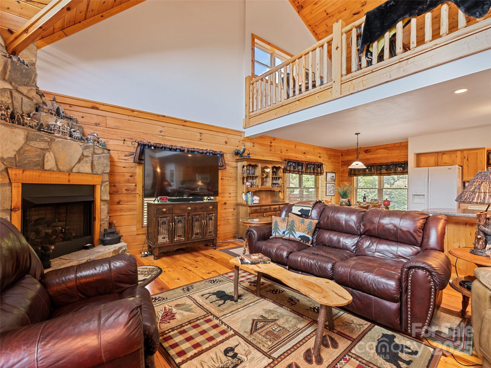 432 Raccoon Point Waynesville, NC 28786 - Photo 8 of 48 a outdoor living space with patio furniture and a fireplace