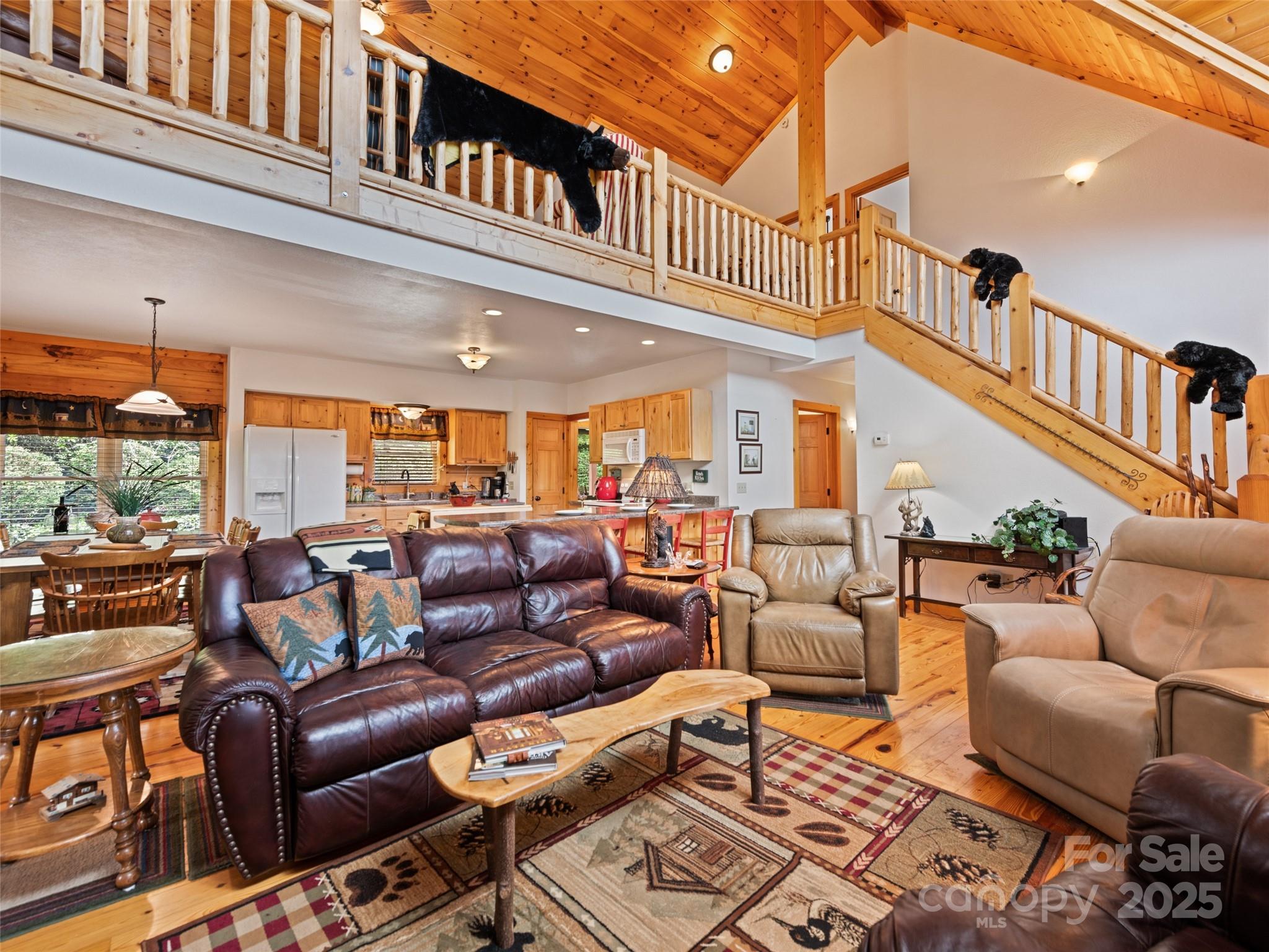 432 Raccoon Point Waynesville, NC 28786 - Photo 9 of 48 a media room with lots of chairs and a projector