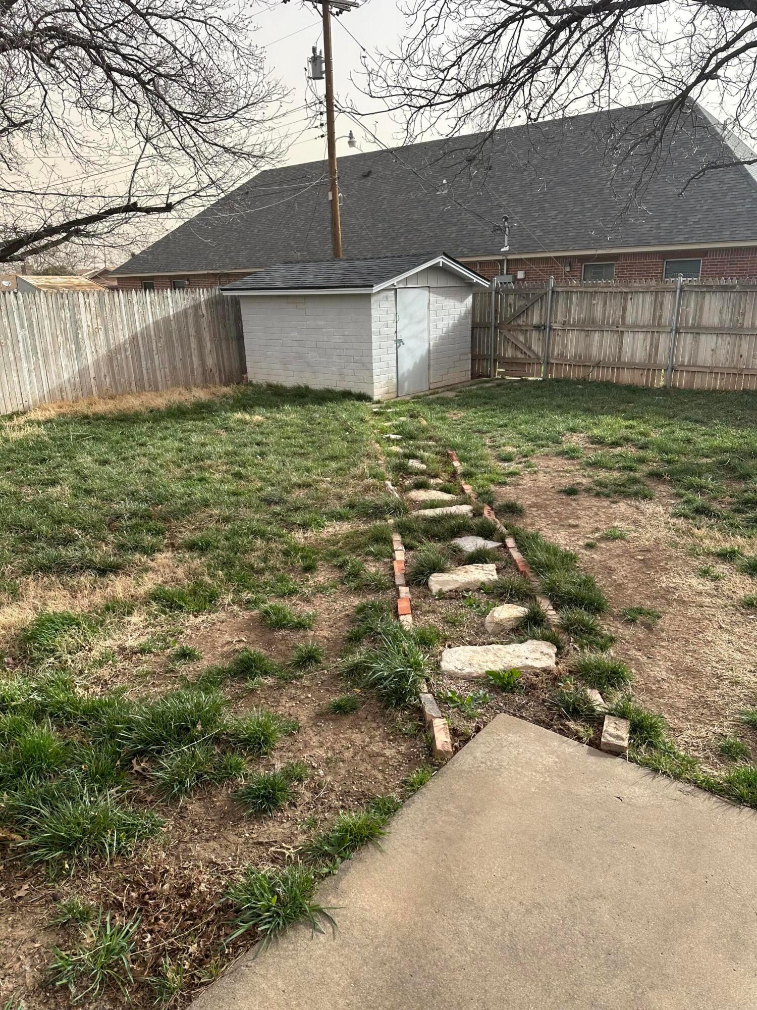 3621 Thurman Street Amarillo, TX 79109 - Photo 11 of 13 a view of a yard with an trees