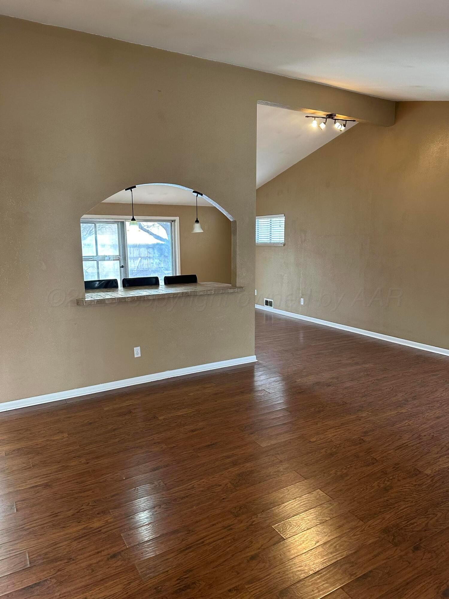 3621 Thurman Street Amarillo, TX 79109 - Photo 2 of 13 a view of a livingroom with wooden floor