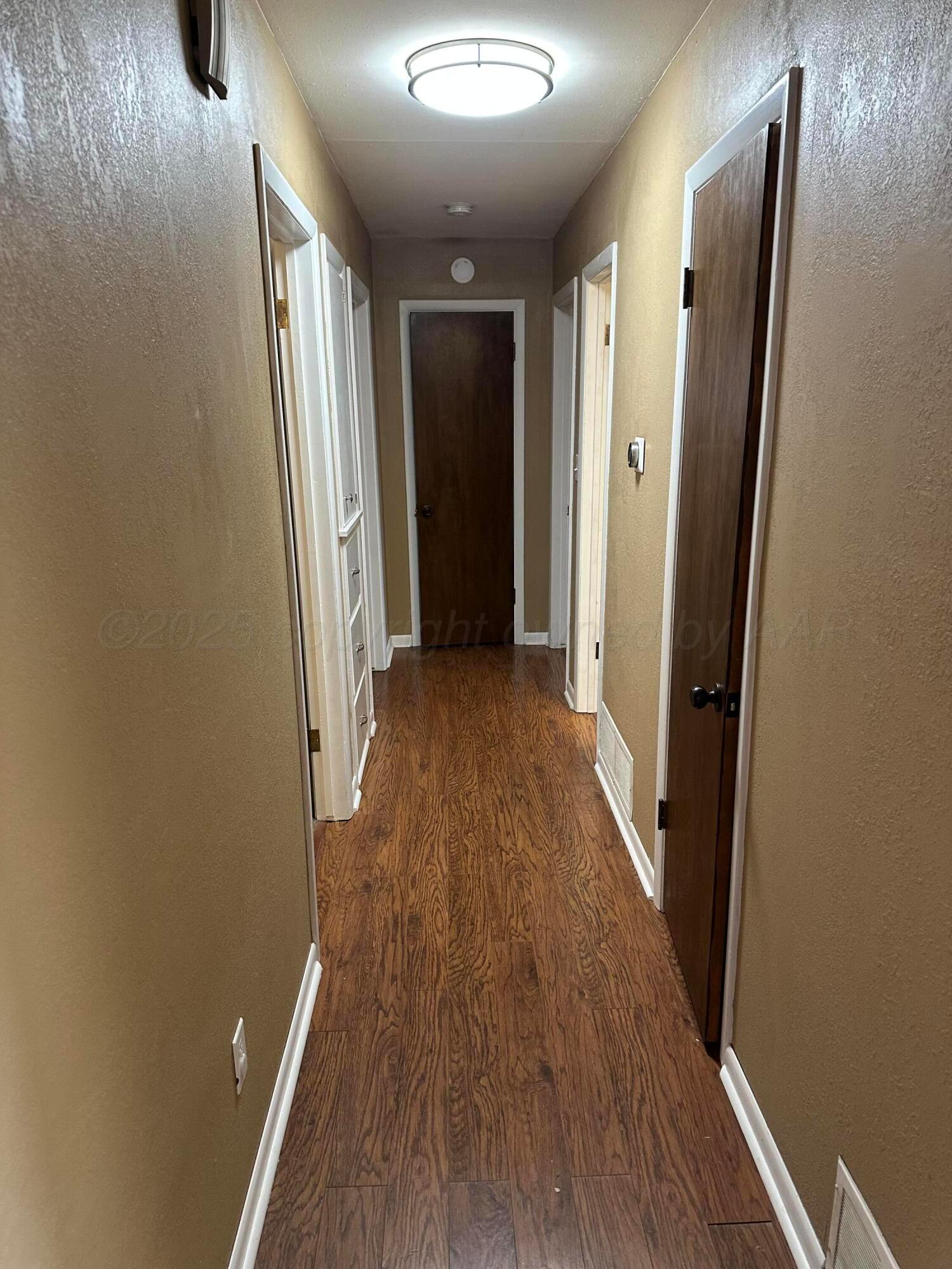 3621 Thurman Street Amarillo, TX 79109 - Photo 7 of 13 wooden floor in a gallery