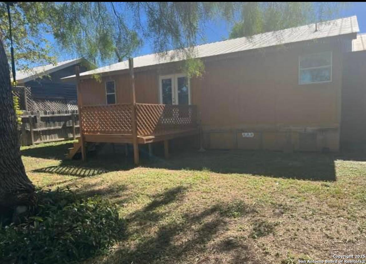 a view of a house with a small yard