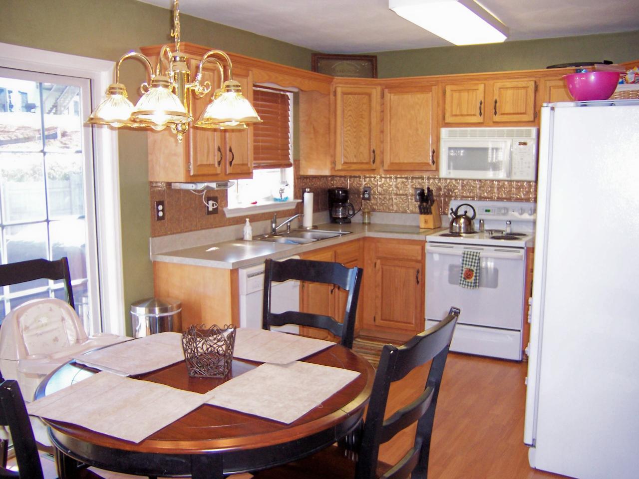1712 Meadows Road Vinton, VA 24179 - Photo 5 of 23 a kitchen with a dining table chairs and window